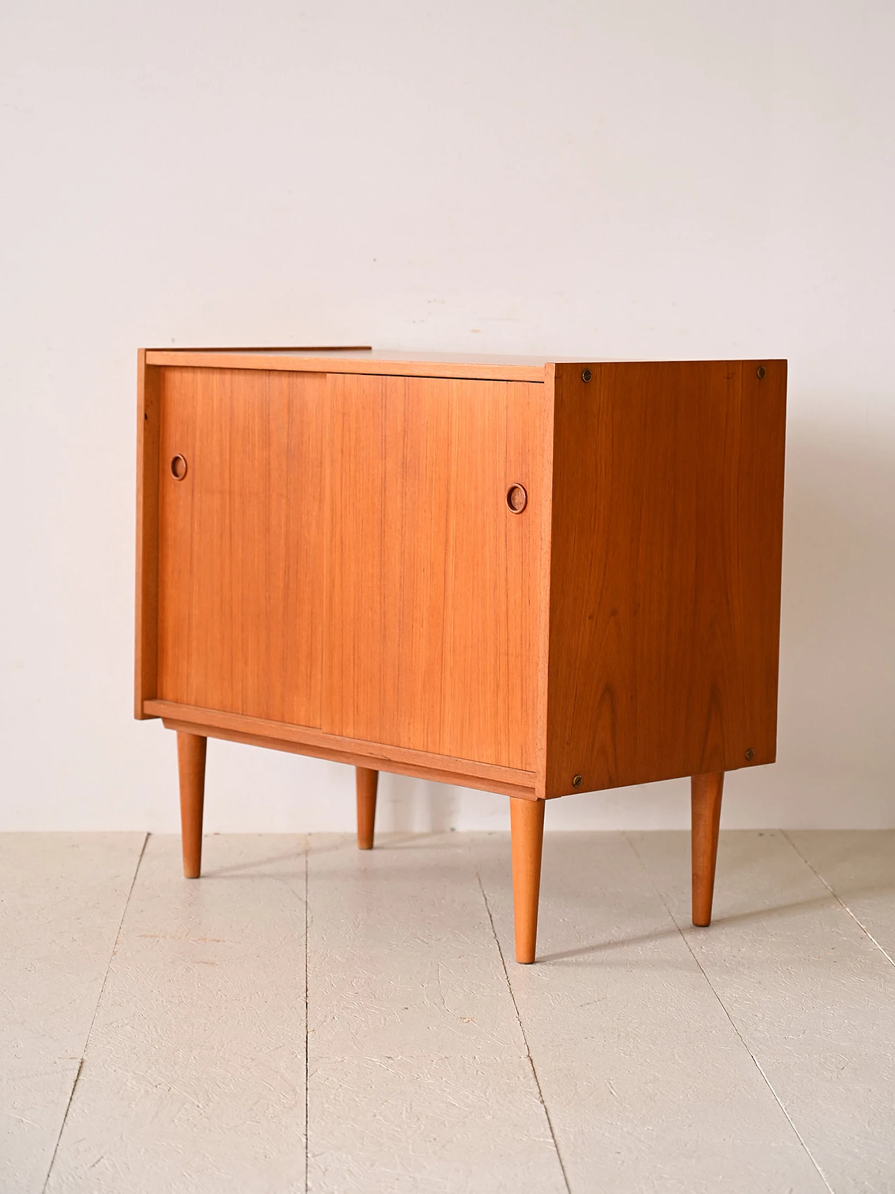Teak sideboard with sliding doors with cone-shaped legs, 1960s 6