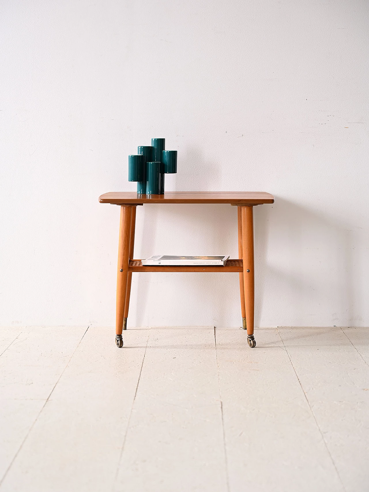 Teak coffee table with wheels and rattan magazine rack, 1960s 1