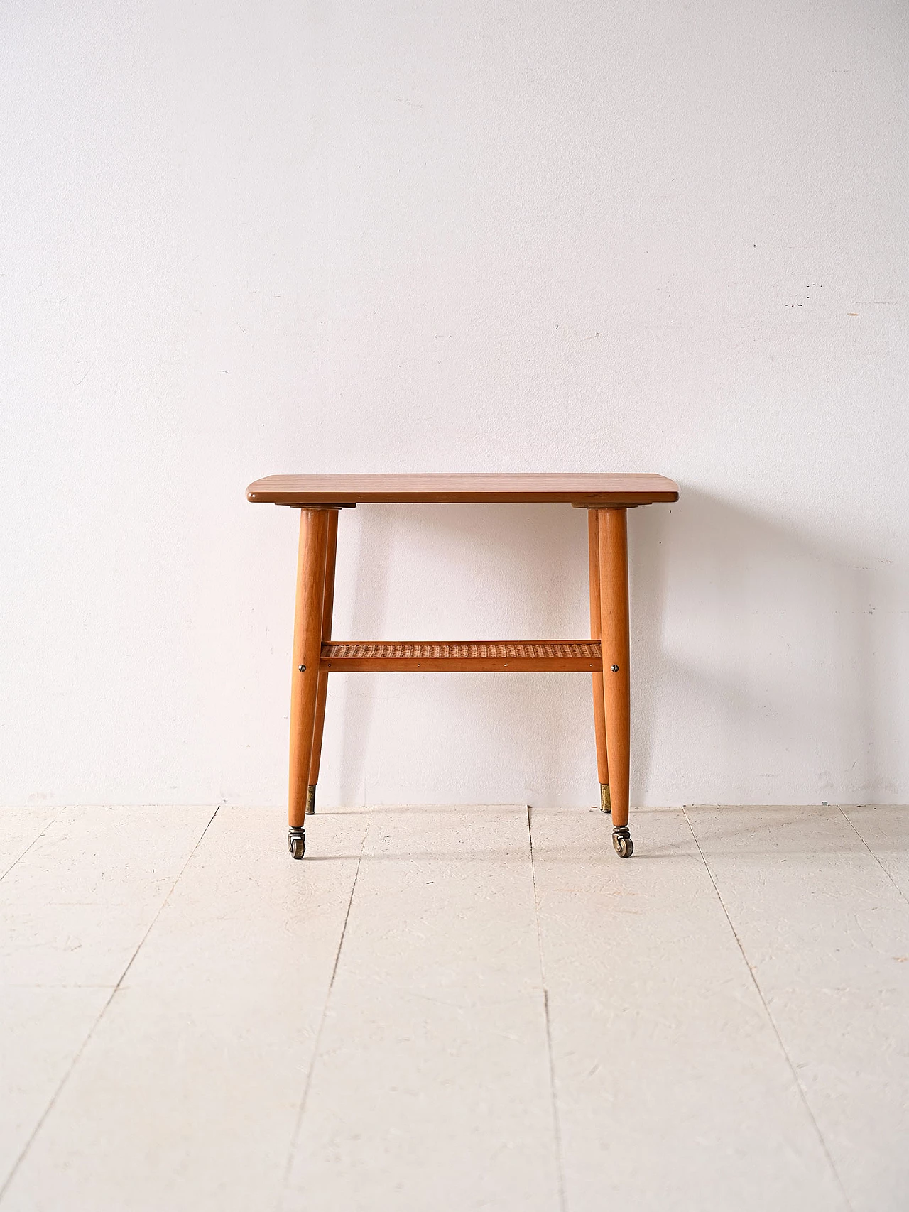 Teak coffee table with wheels and rattan magazine rack, 1960s 2