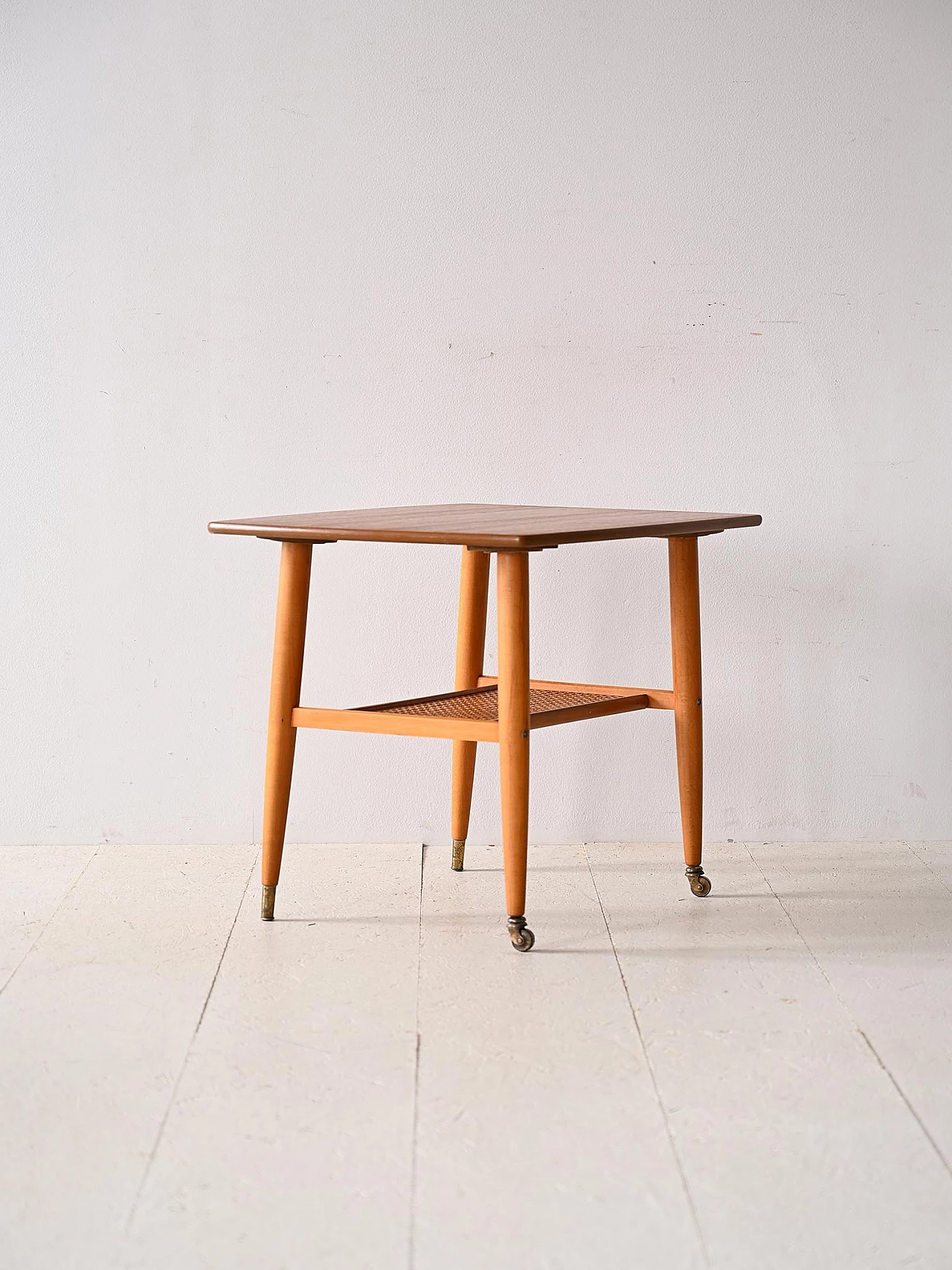 Teak coffee table with wheels and rattan magazine rack, 1960s 3