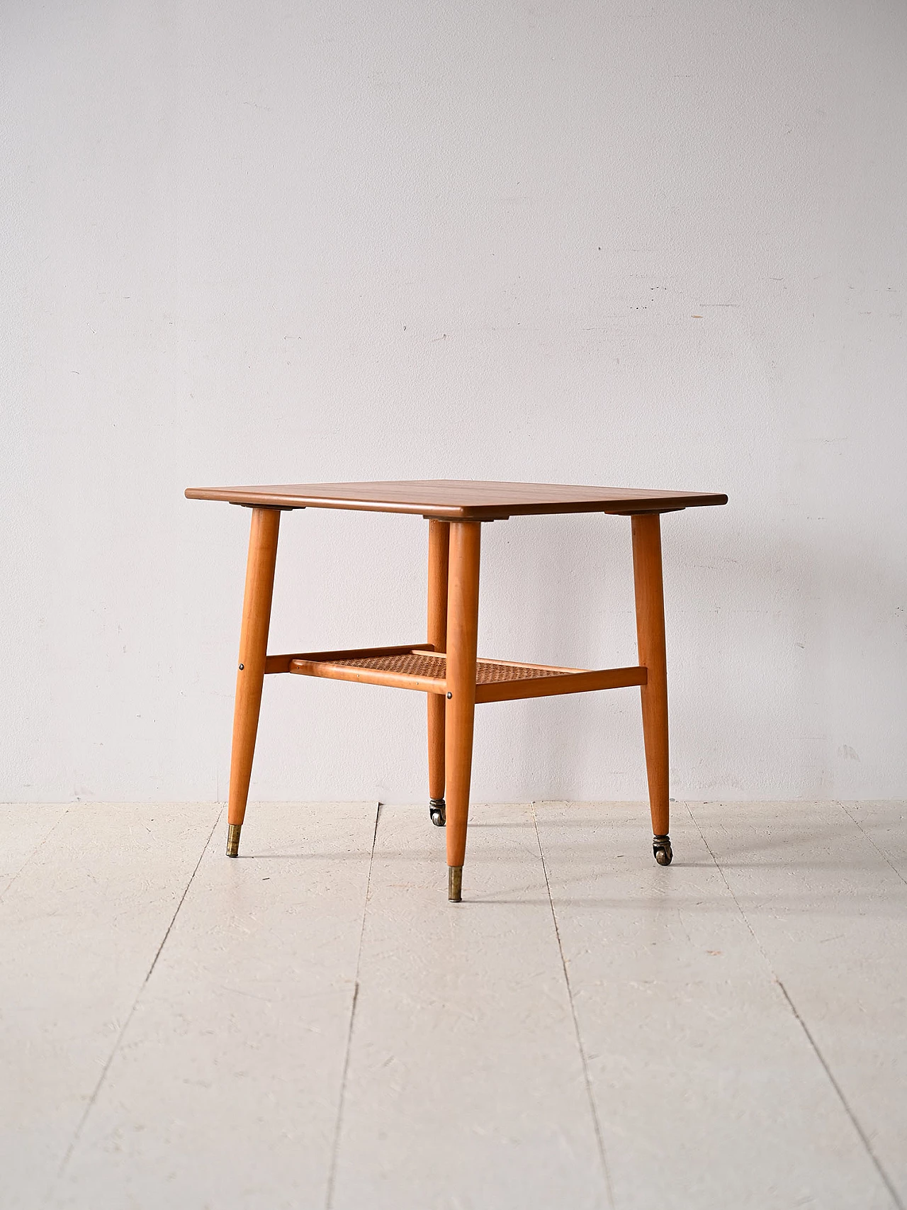 Teak coffee table with wheels and rattan magazine rack, 1960s 4