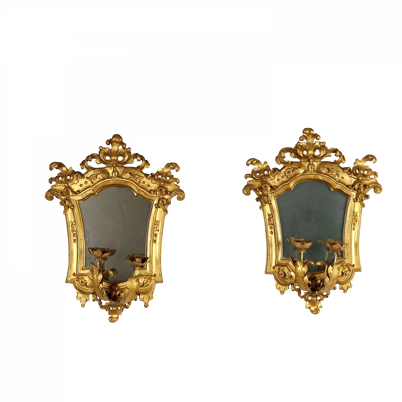 Pair of Baroque embossed sheet metal mirrors with lamp-holding arms, early 18th century 1