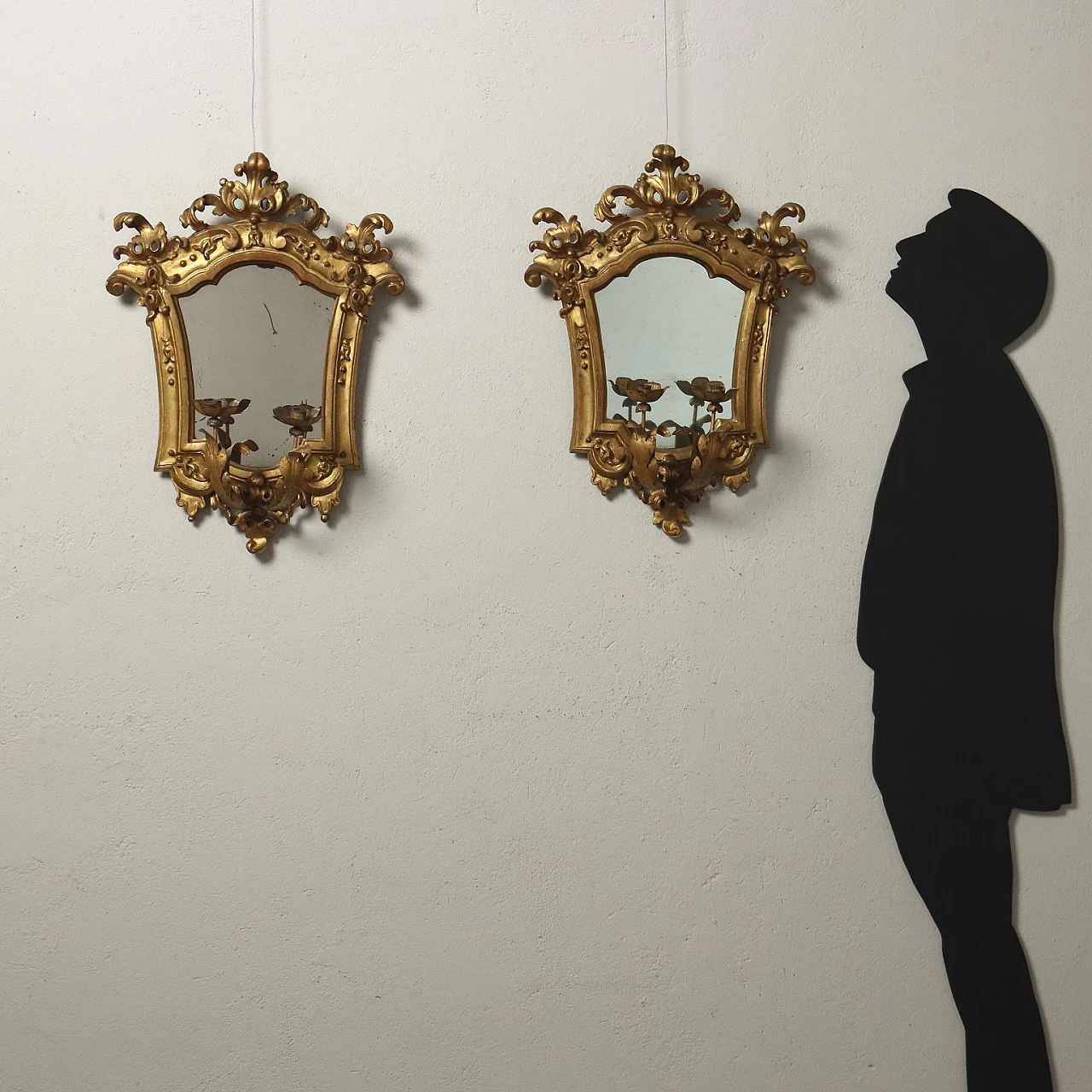 Pair of Baroque embossed sheet metal mirrors with lamp-holding arms, early 18th century 2