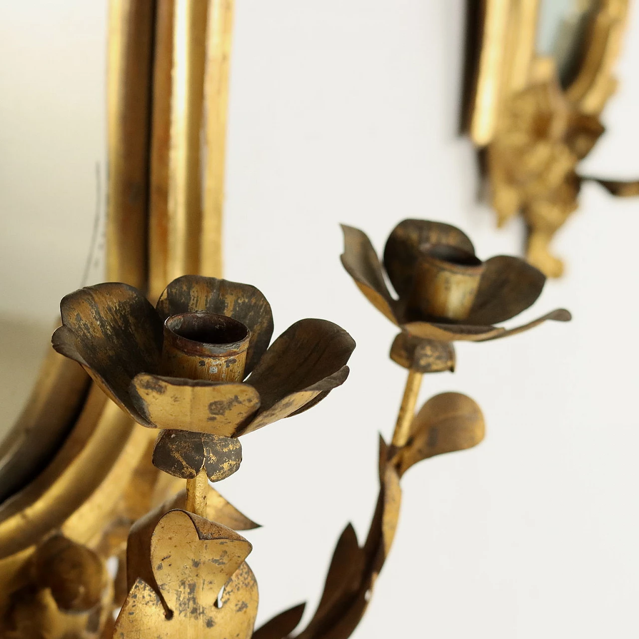 Pair of Baroque embossed sheet metal mirrors with lamp-holding arms, early 18th century 6