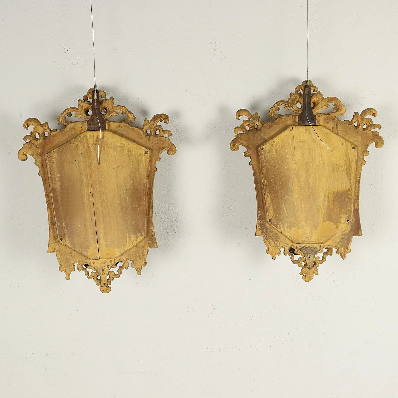 Pair of Baroque embossed sheet metal mirrors with lamp-holding arms, early 18th century 7