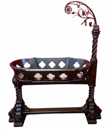 Carved wood and wrought iron cradle, early 20th century