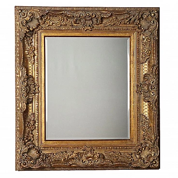 Beveled mirror with gilded carved frame