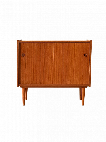 Teak sideboard with sliding doors with cone-shaped legs, 1960s