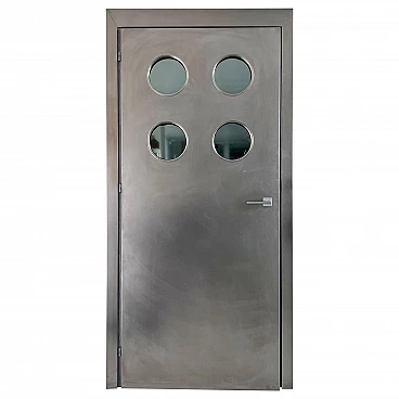 Steel door with portholes in the style of Jean Prouvé