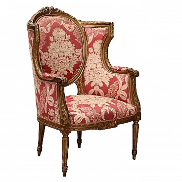 Armchair in carved wood and red decorated fabric, 19th century