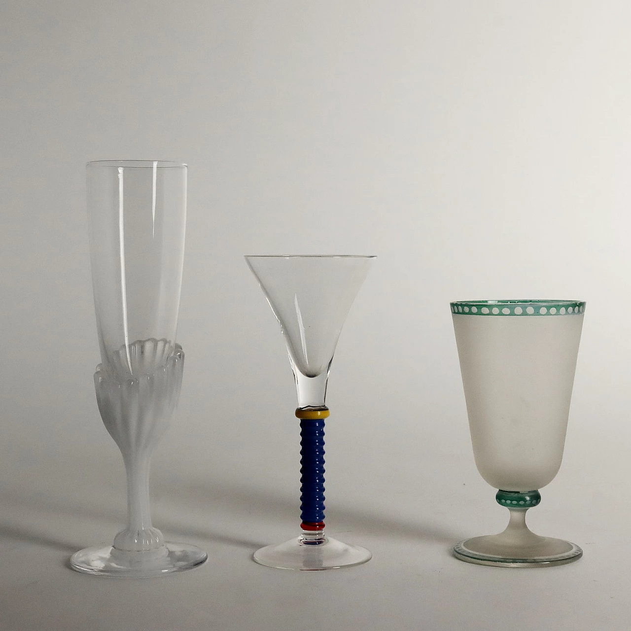 7 glasses in glass of different manufactures and shapes 3