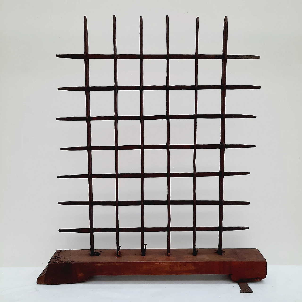 Black wrought iron grate with wooden base, 18th century 1