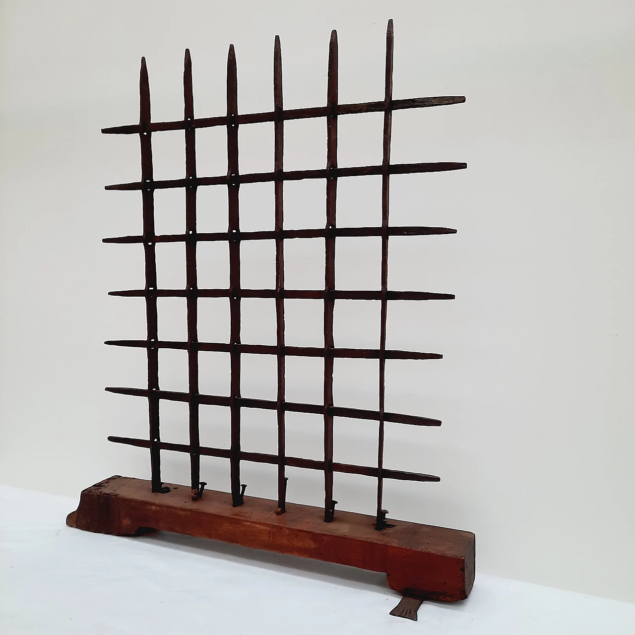 Black wrought iron grate with wooden base, 18th century 3