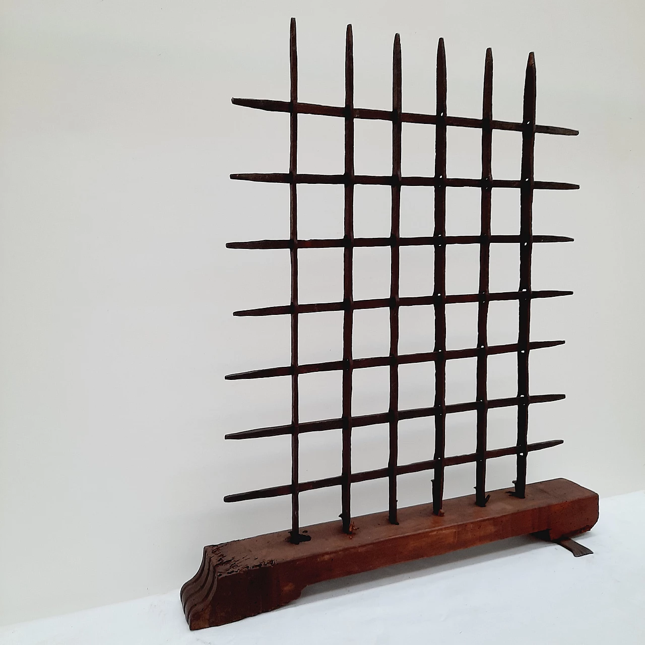 Black wrought iron grate with wooden base, 18th century 4