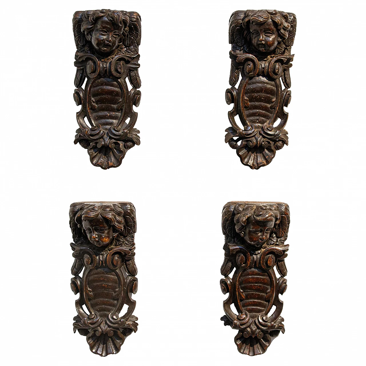 4 Fregi con teste di putto e stemmi in legno, '600 1