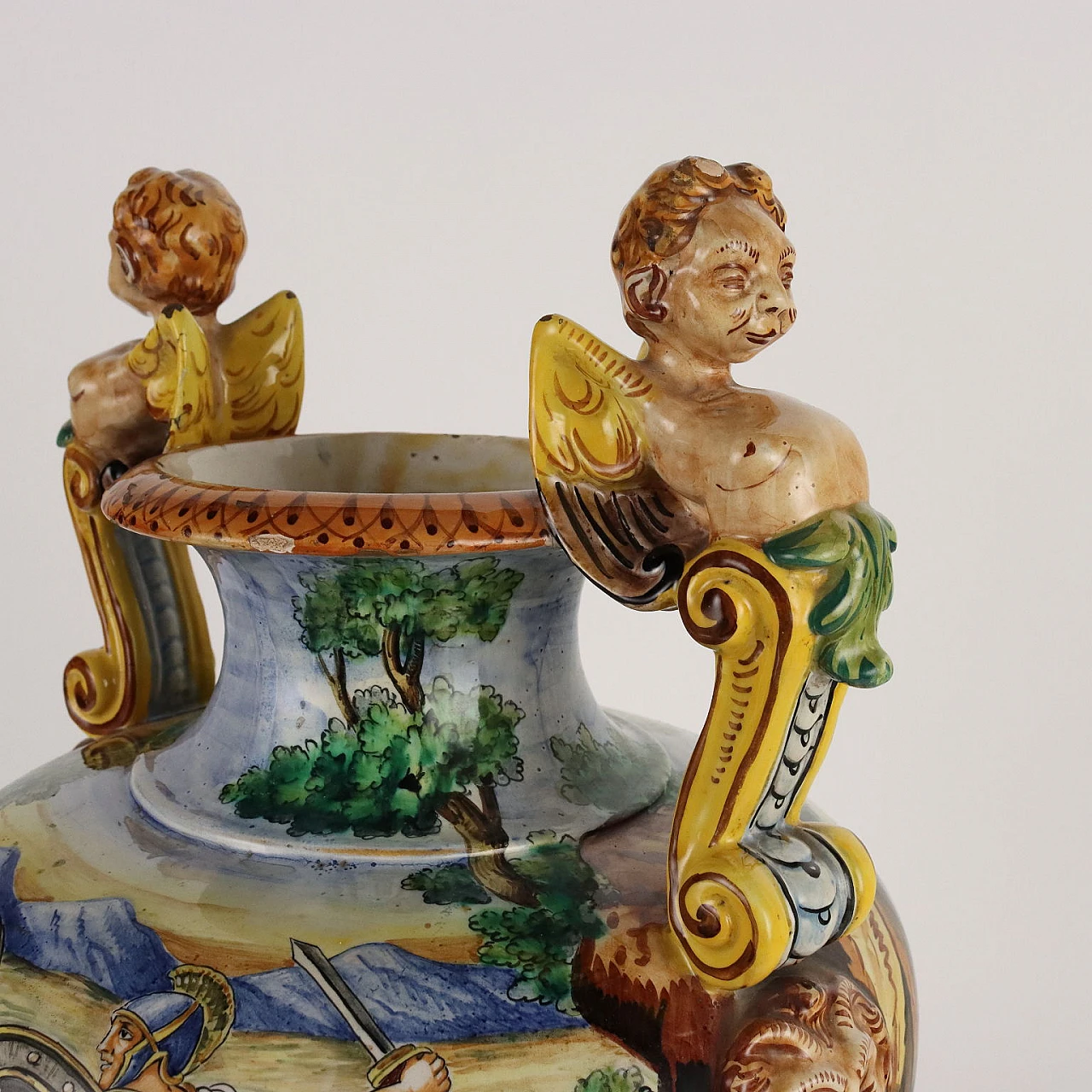 Painted majolica vase with winged figures and masks 7