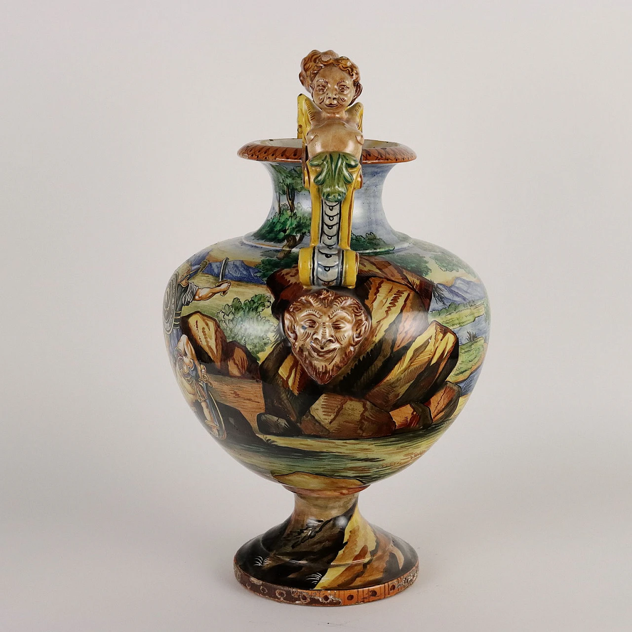 Painted majolica vase with winged figures and masks 9