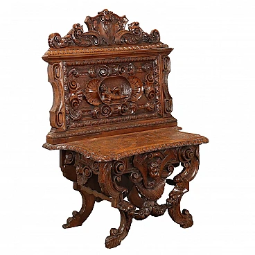 Walnut bench carved with phytomorphic motifs & frets, 19th century