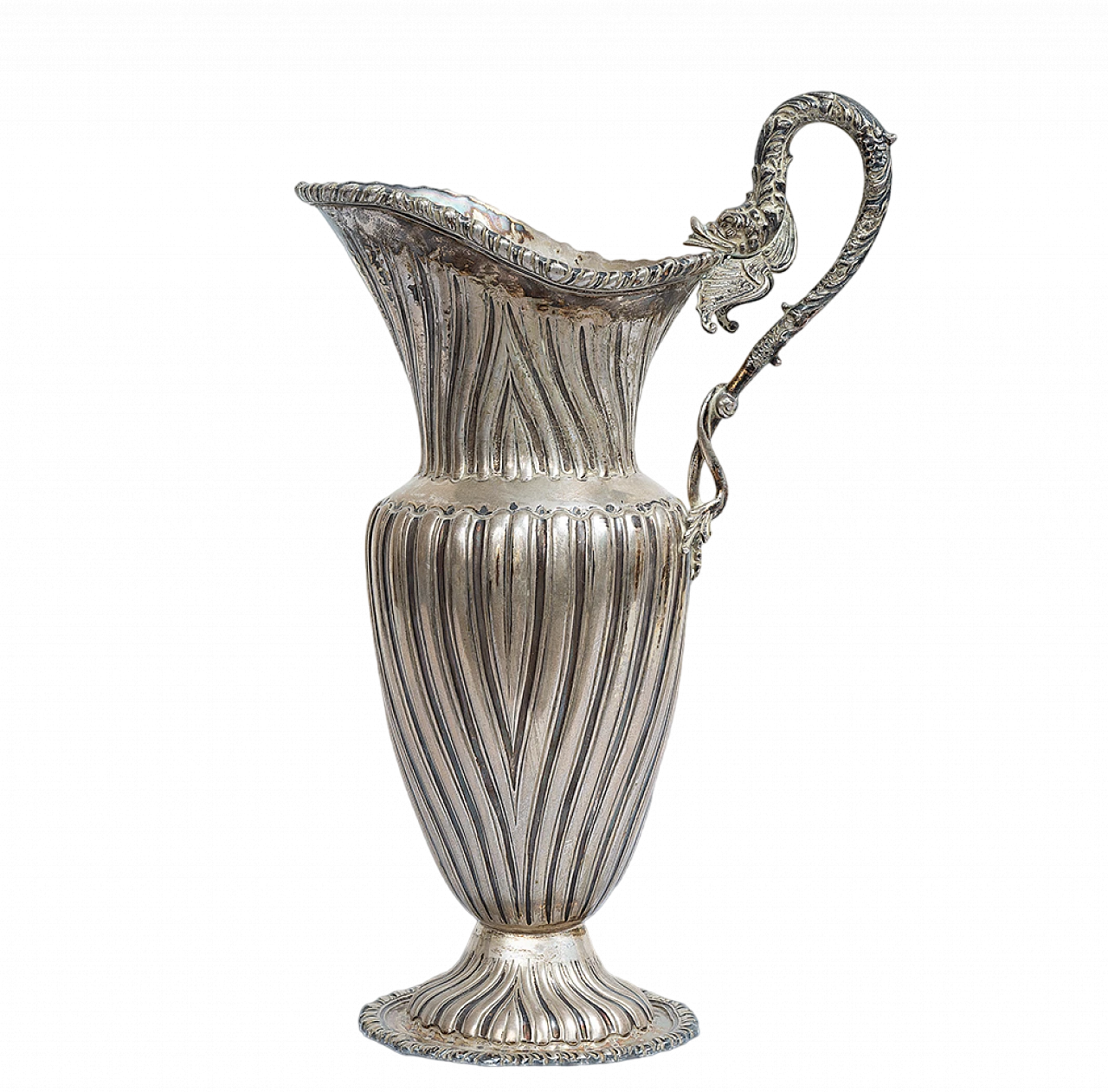 Silver sinusoidal-shaped jug with thick chisel on the edge 9