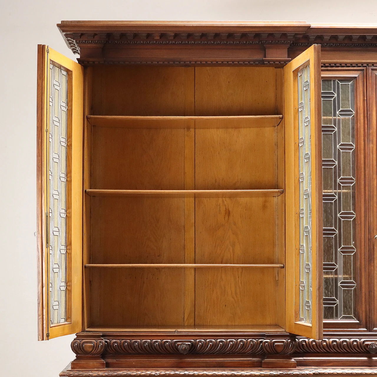 Carved walnut bookcase with leaded glass doors, 19th century 10