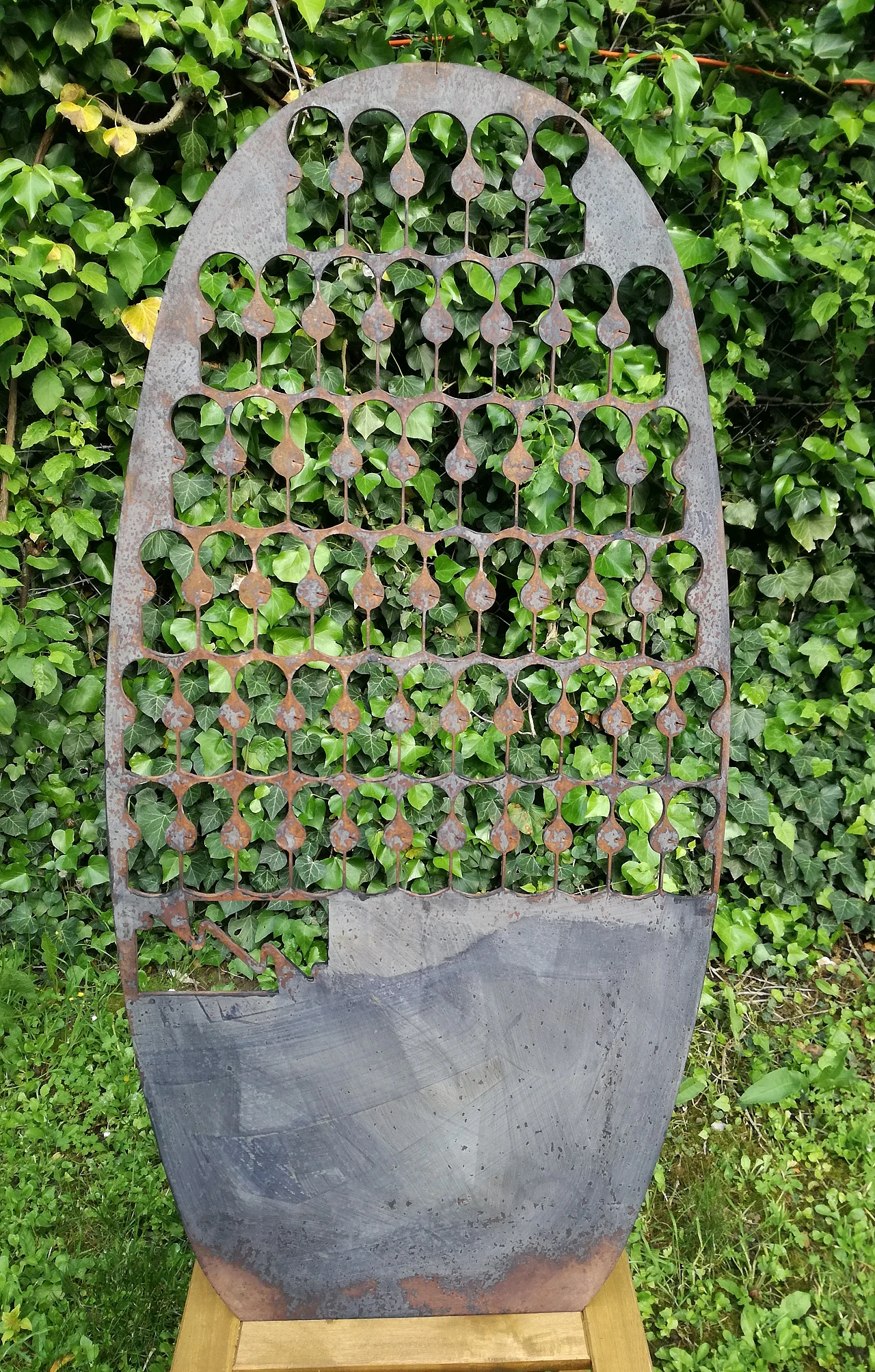 Oval iron panel, 1980s 16