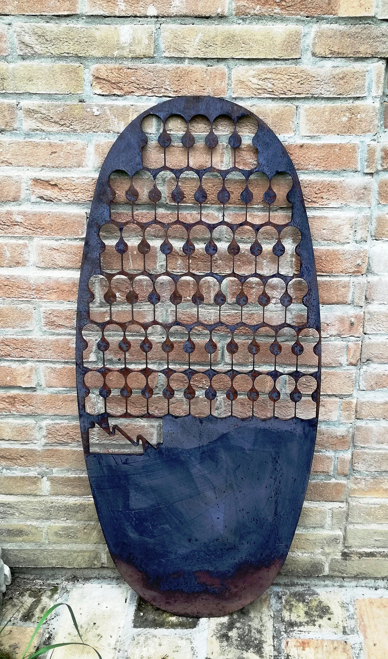 Oval iron panel, 1980s 17