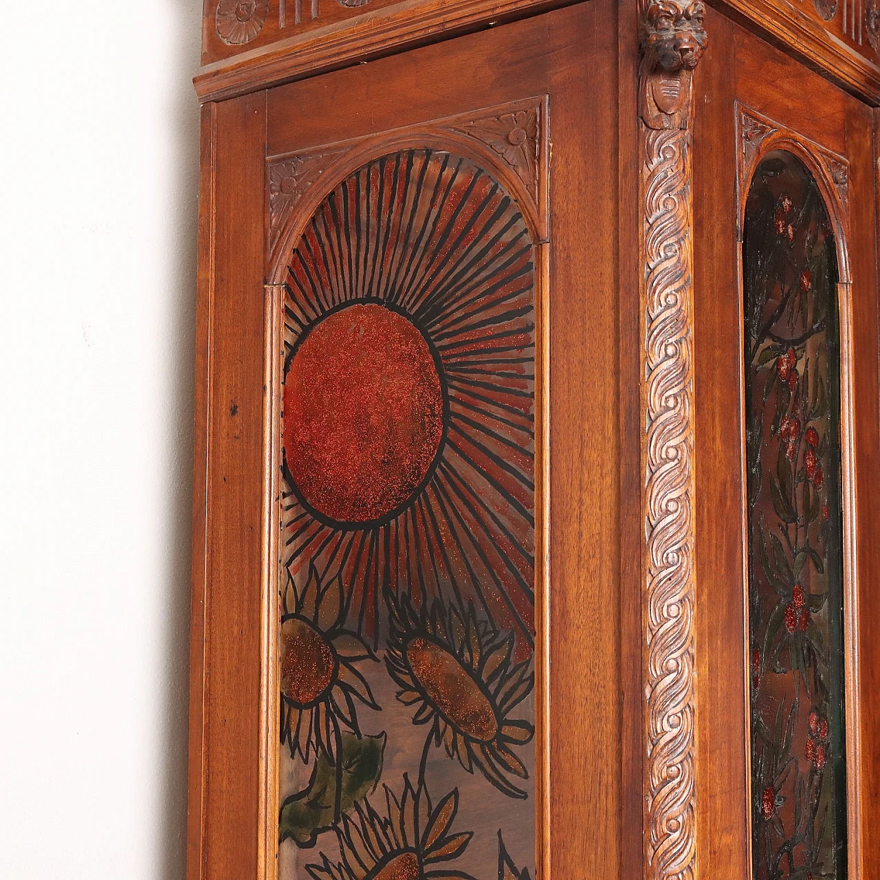Carved walnut showcase with turned feet and back-painted glass 10