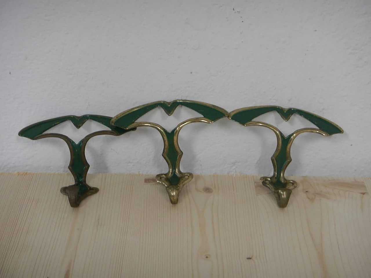 3 Gilded and green laquered iron clothes hangers, 1950s 1