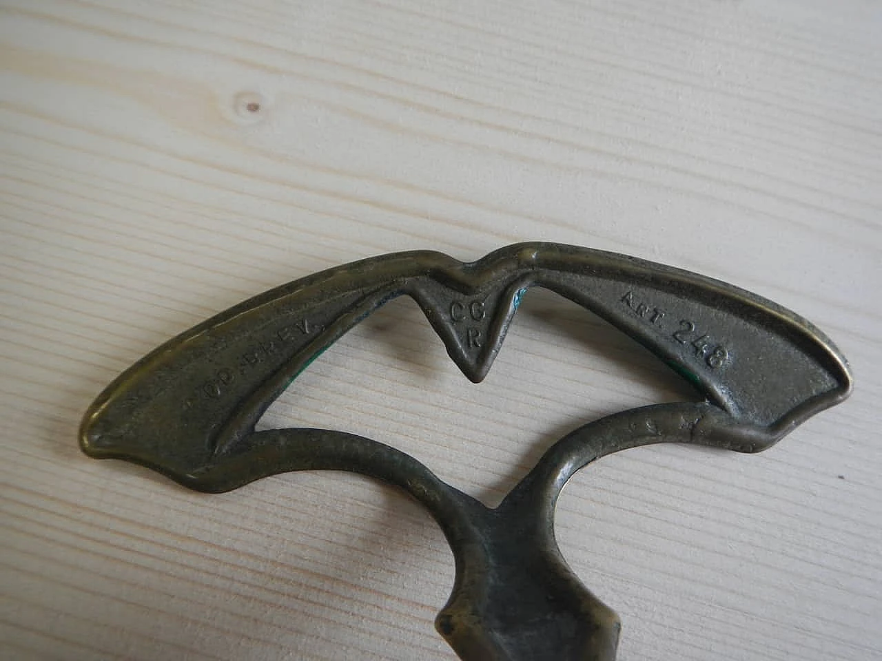 3 Gilded and green laquered iron clothes hangers, 1950s 4