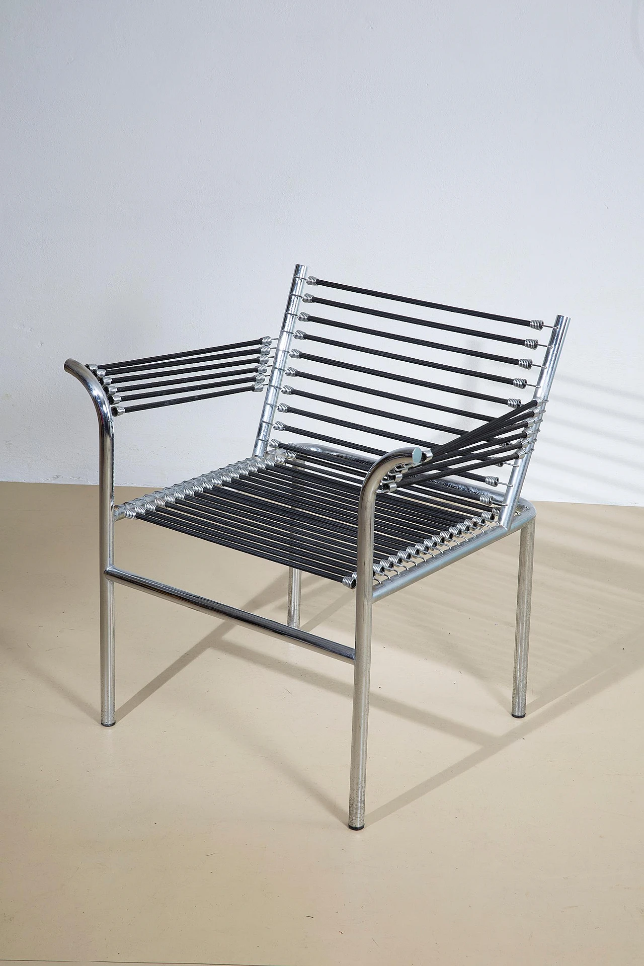 Steel and elastic cord armchair by René Herbst, 1970s 3