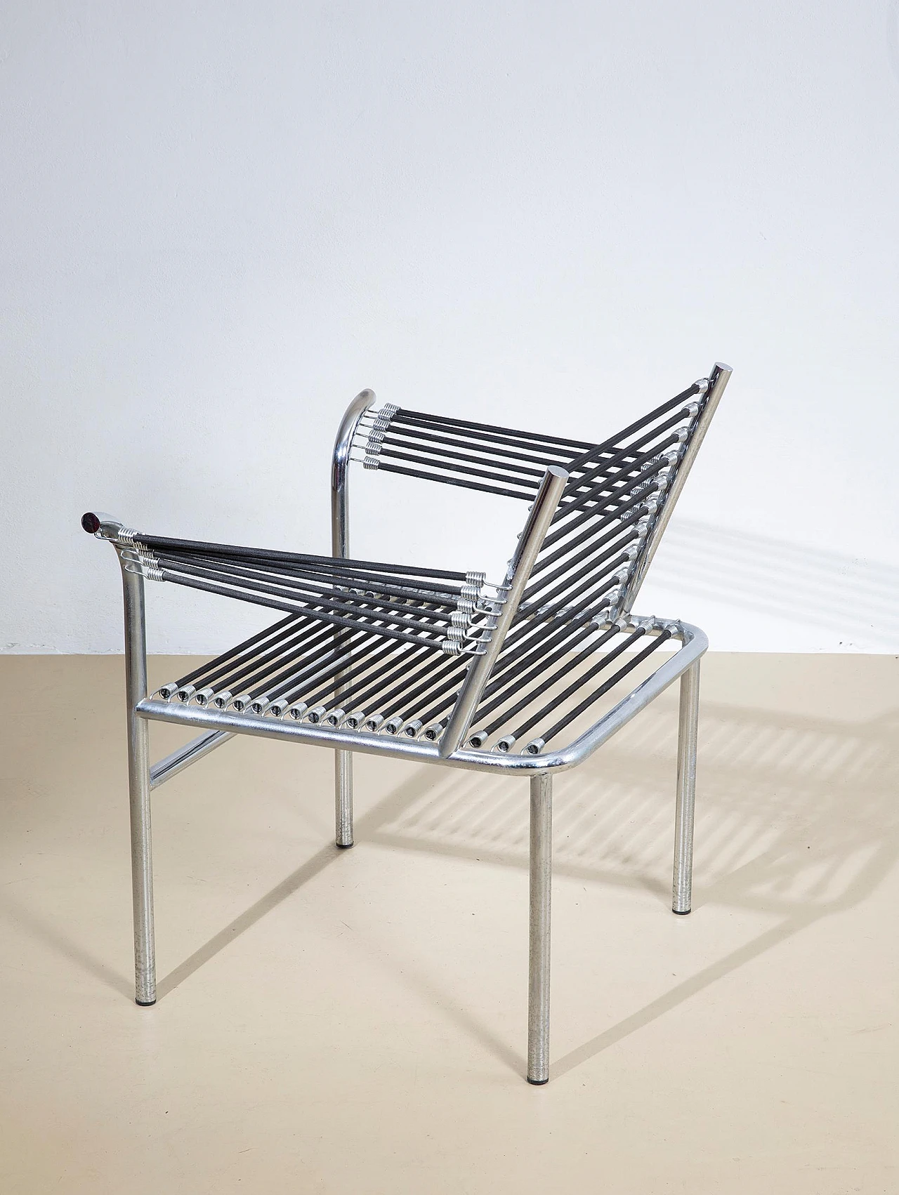 Steel and elastic cord armchair by René Herbst, 1970s 5