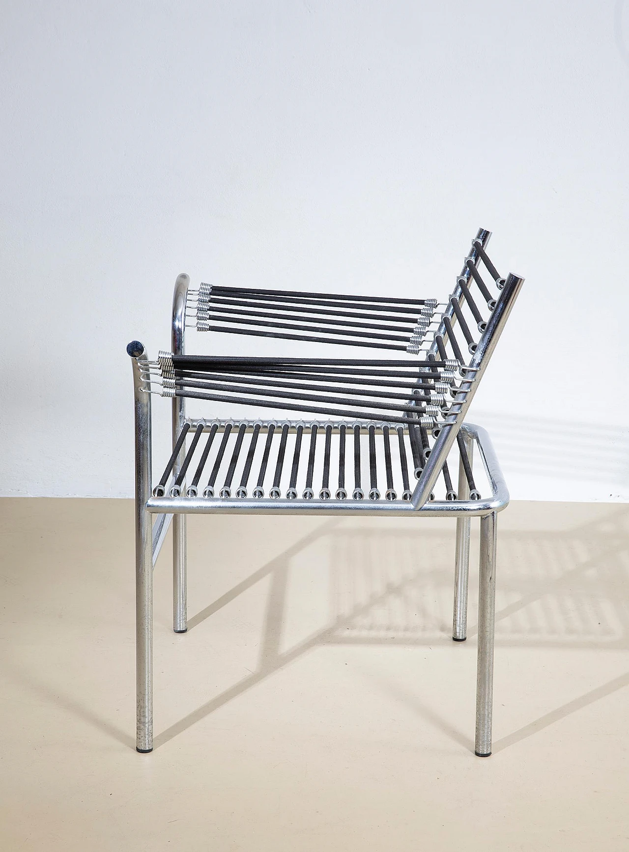Steel and elastic cord armchair by René Herbst, 1970s 6