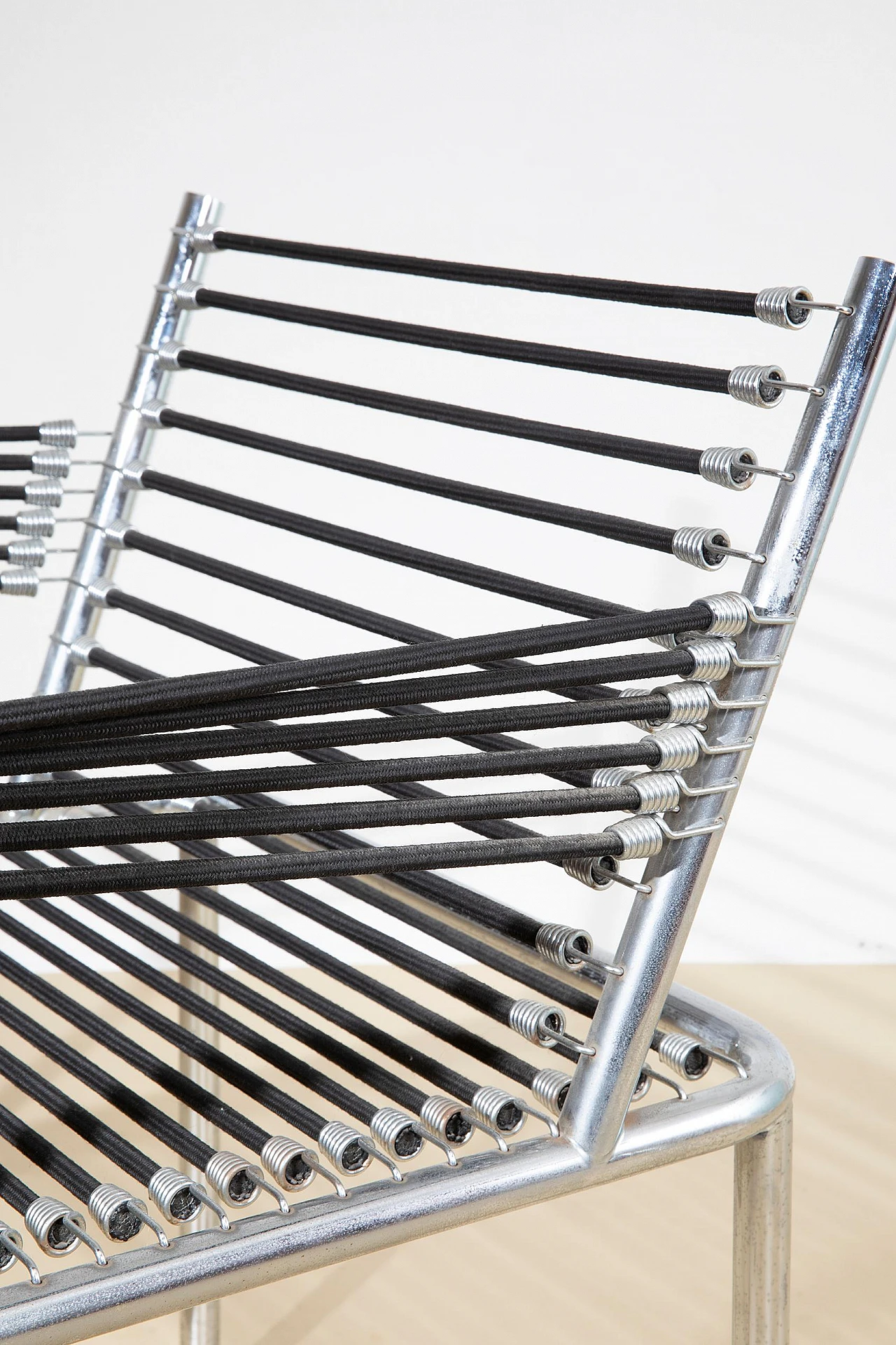 Steel and elastic cord armchair by René Herbst, 1970s 8