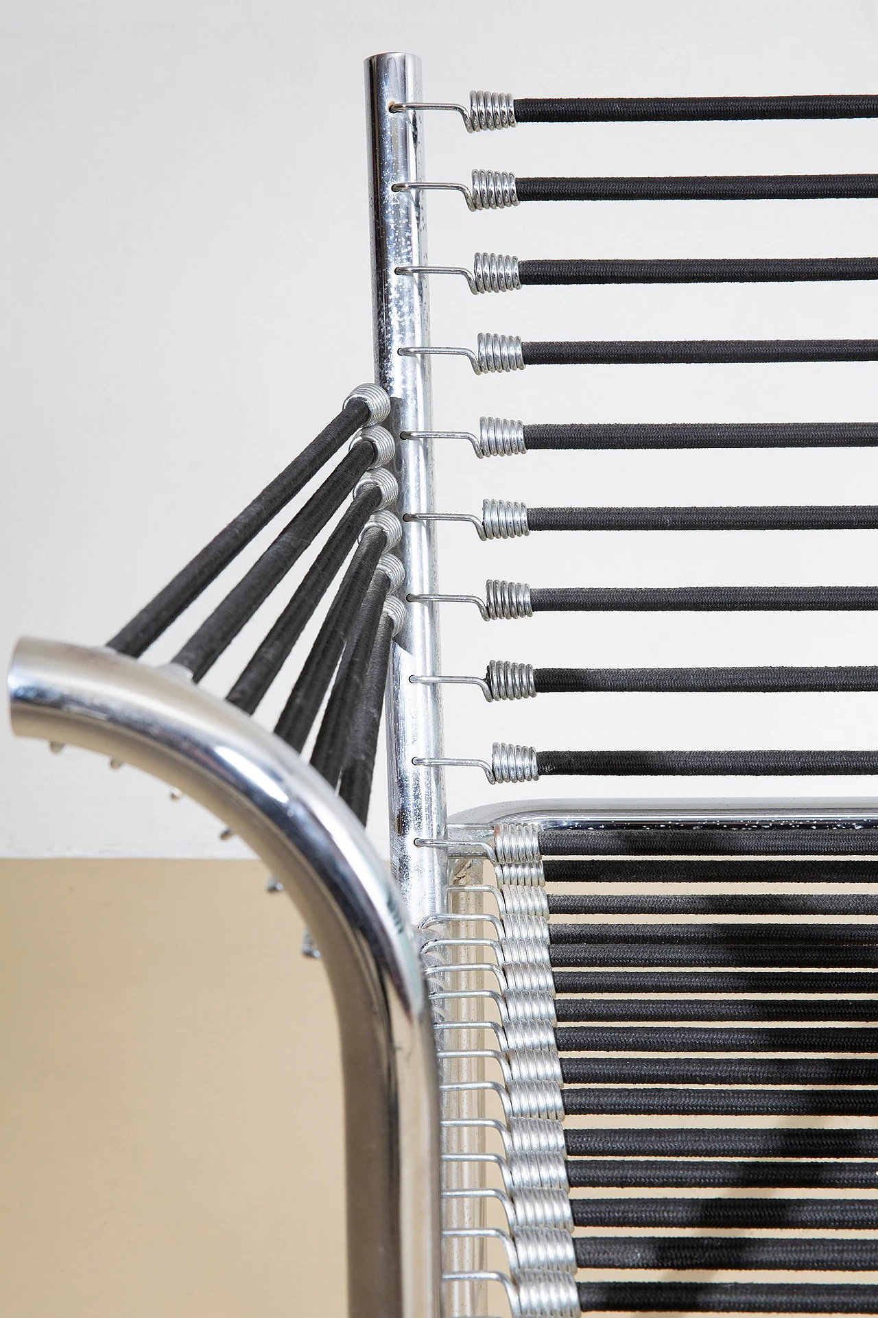 Steel and elastic cord armchair by René Herbst, 1970s 9