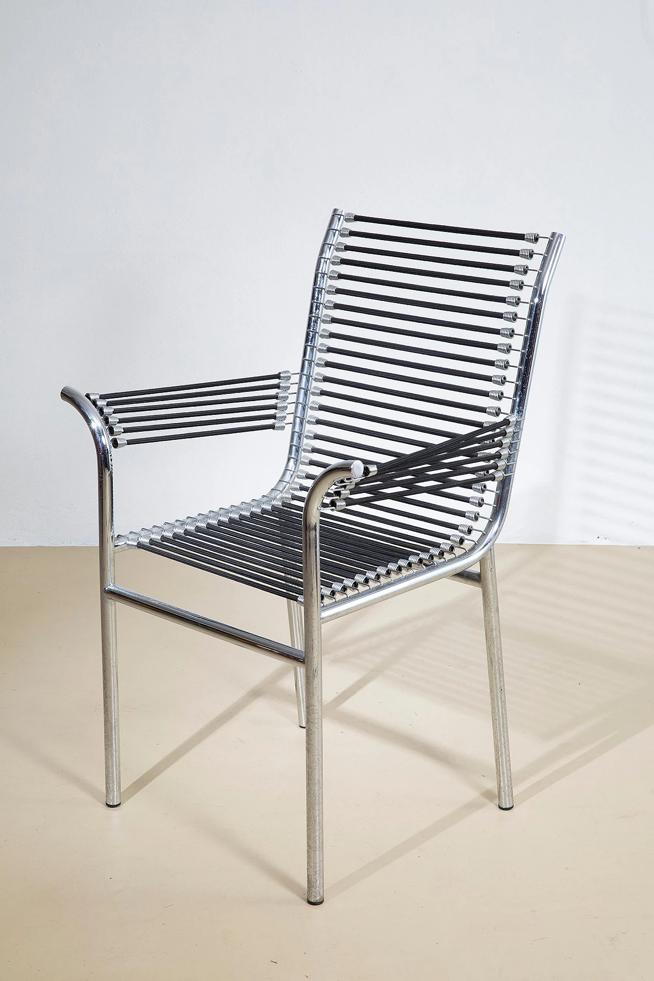 Steel and elastic cord armchair by René Herbst, 1970s 11