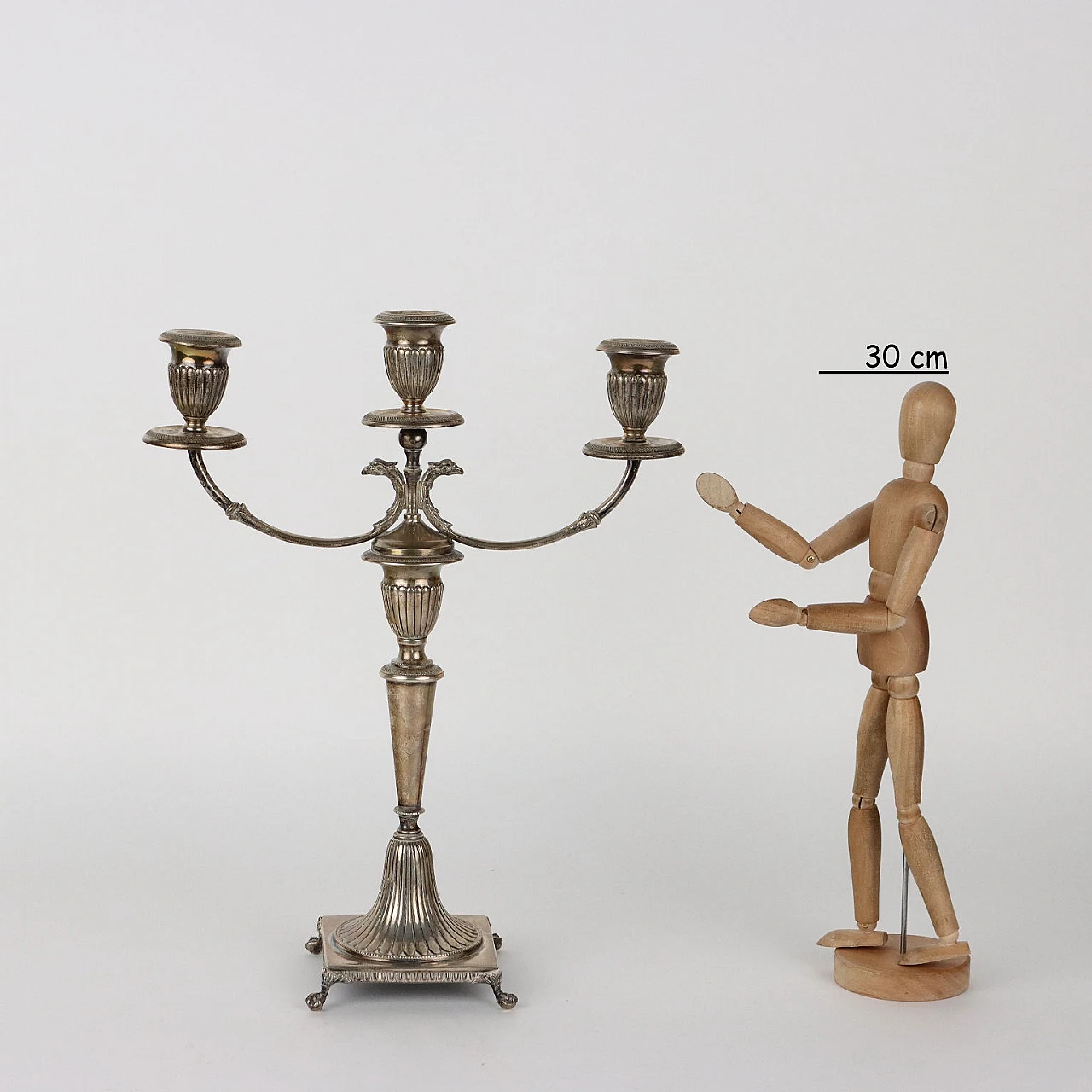 Three-armed silver candelabra with four ferine-shaped feet 2