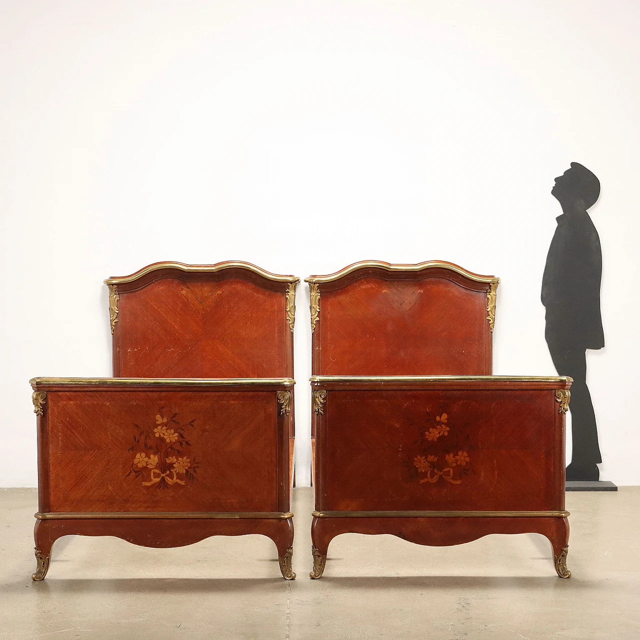 Pair of mahogany bed frames with bronze and brass details 2