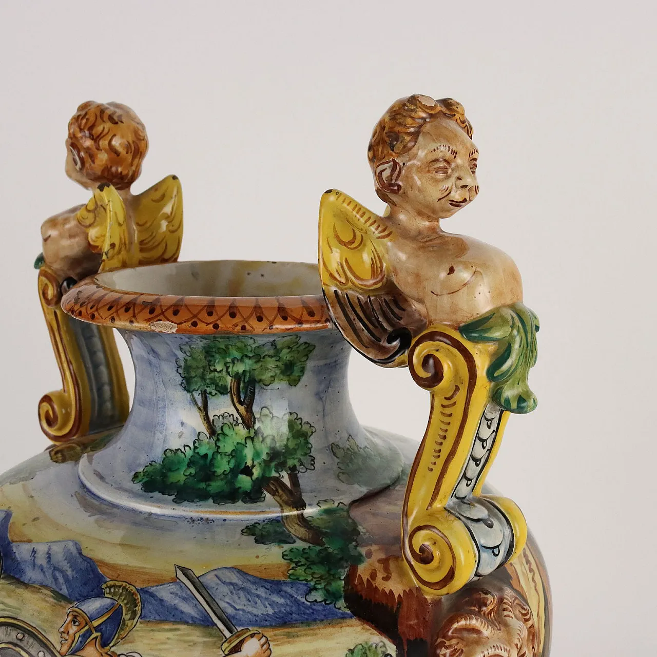 Painted majolica vase with winged figures and masks 8