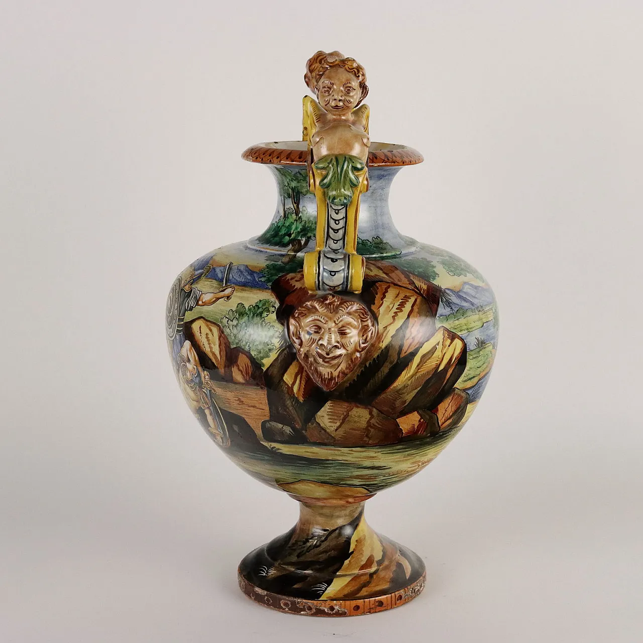 Painted majolica vase with winged figures and masks 10
