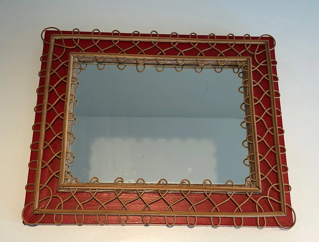 Specchio in rattan su sfondo rosso, anni '40 19