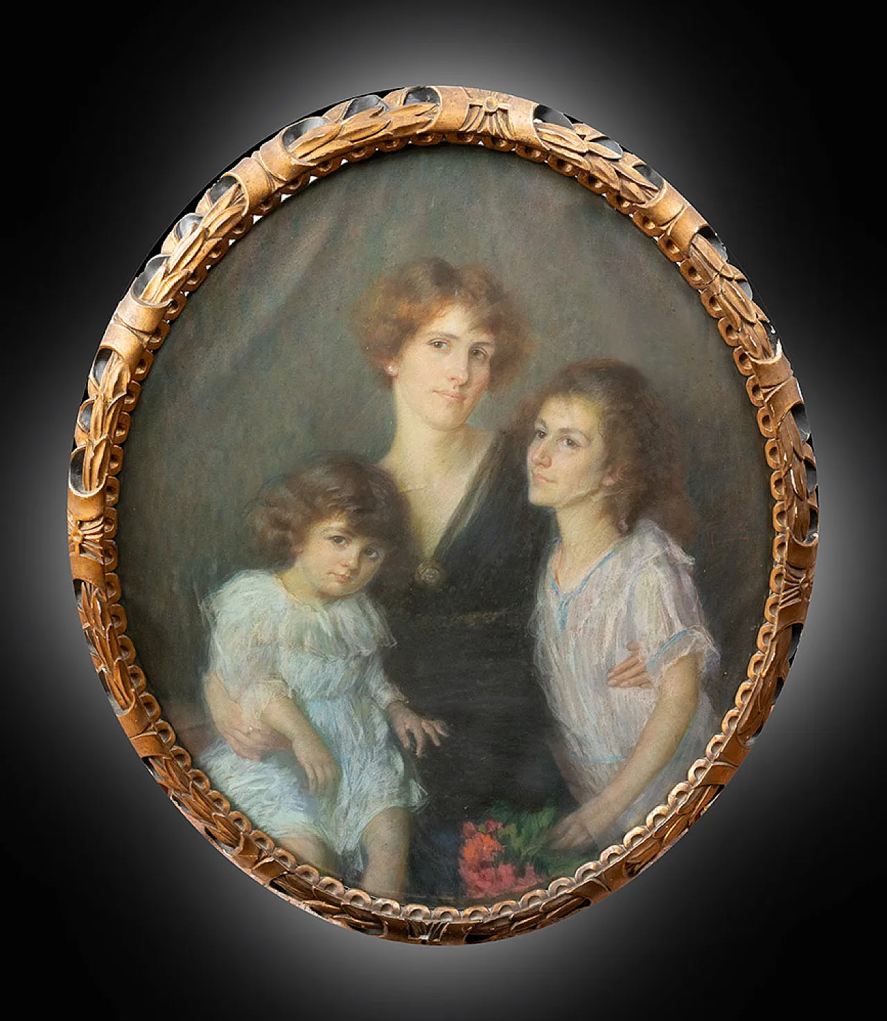 Oval Family portrait, pastel on paper in carved wood frame, 20th c. 1