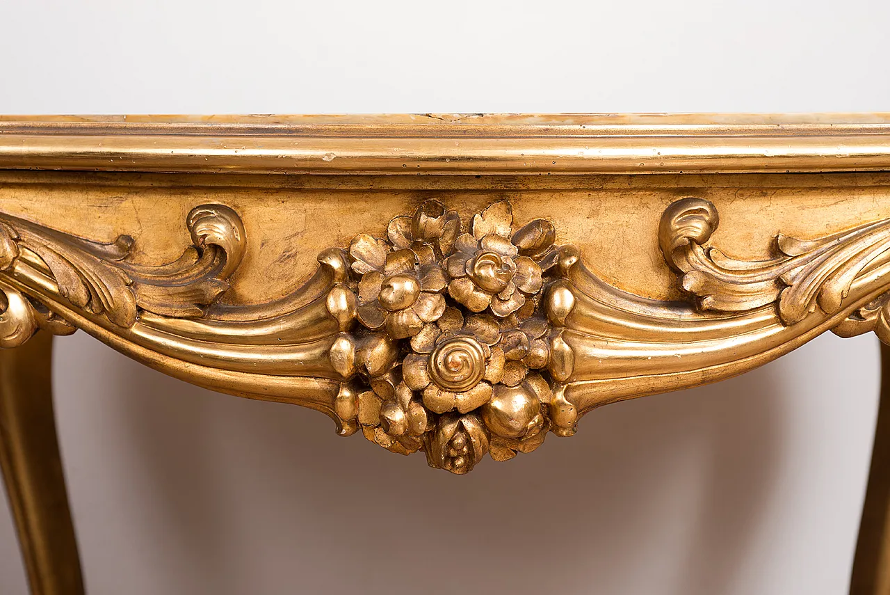 Golden and carved wooden table with Napoleon III onice top, 20th c, 2