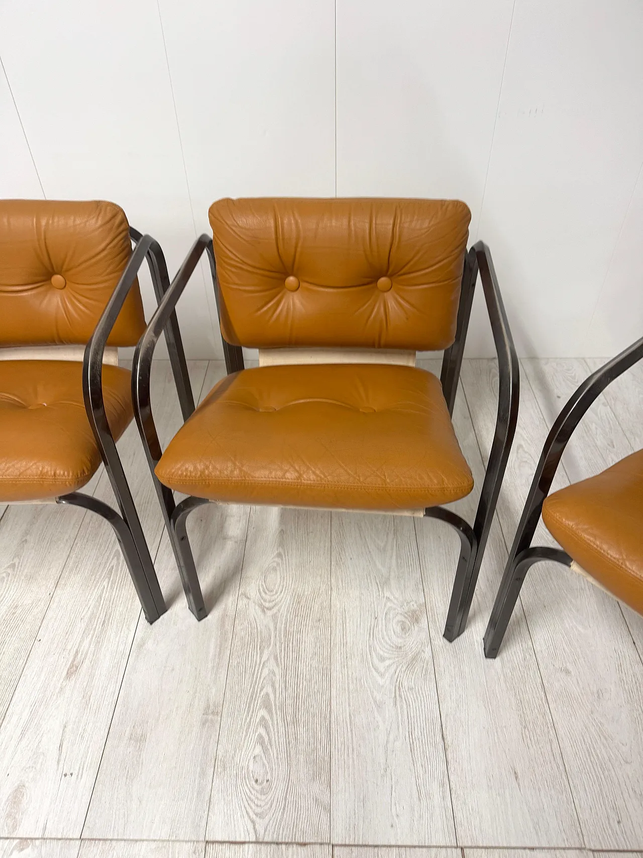 4 Leather armchairs, 1970s 5