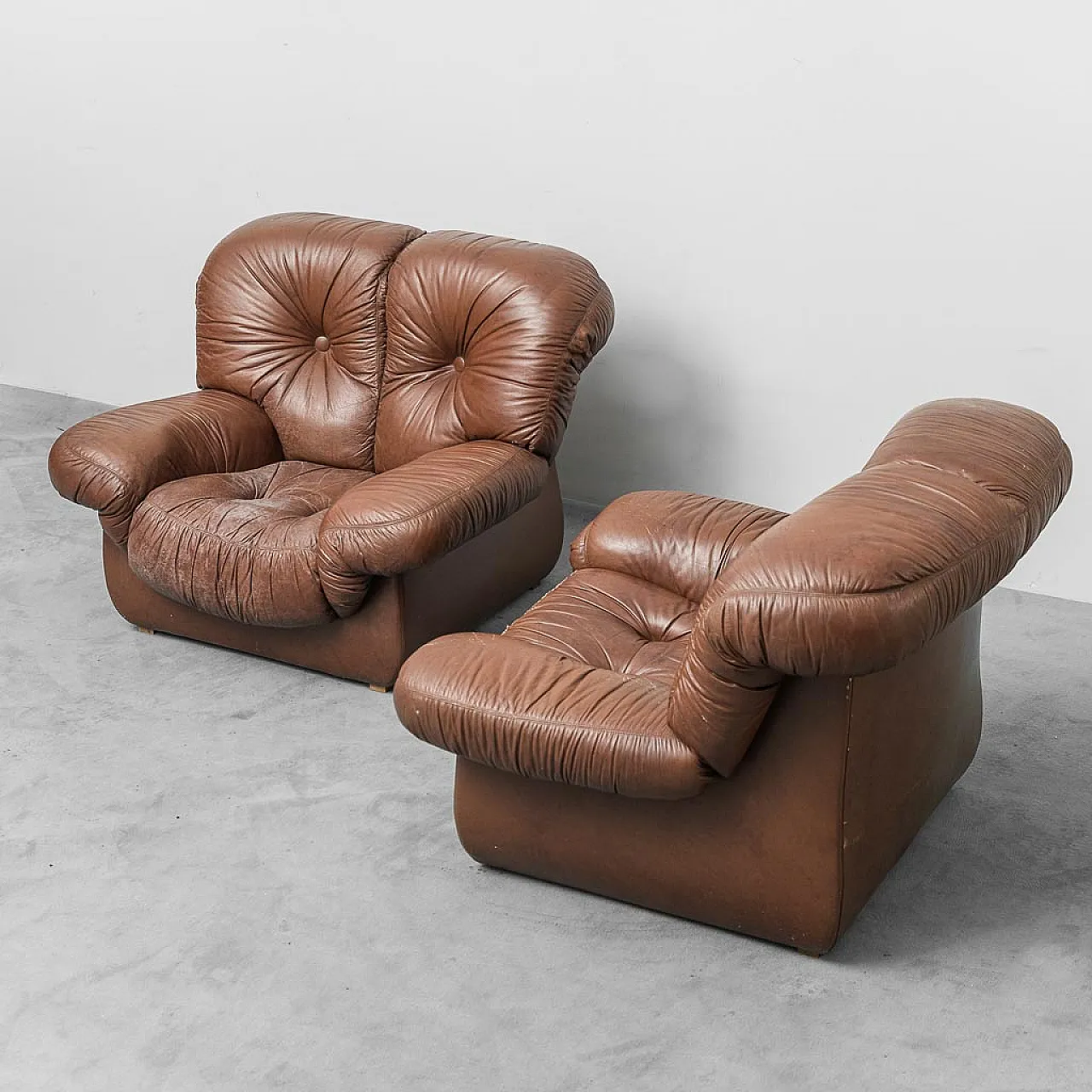 Pair of brown leather armchairs, 70s 1