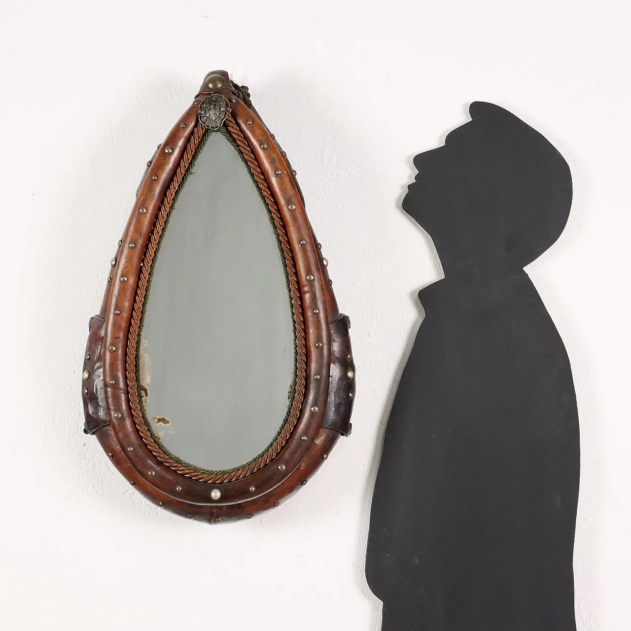 Mirror inside a leather riding saddle with studs 2