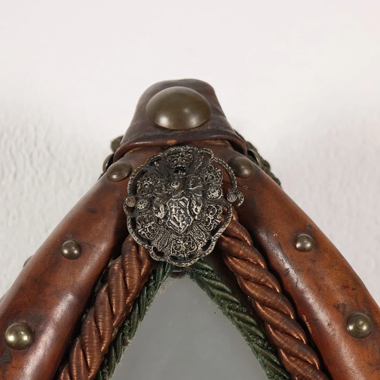 Mirror inside a leather riding saddle with studs 3
