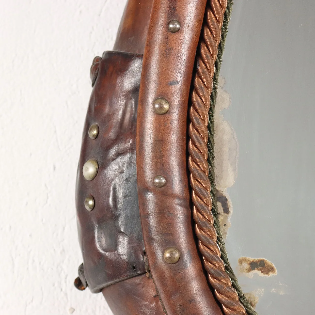 Mirror inside a leather riding saddle with studs 5