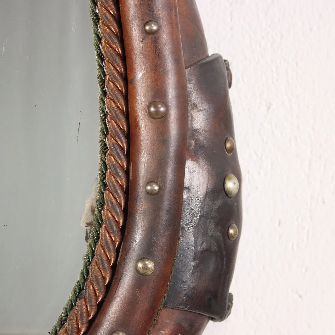 Mirror inside a leather riding saddle with studs 6
