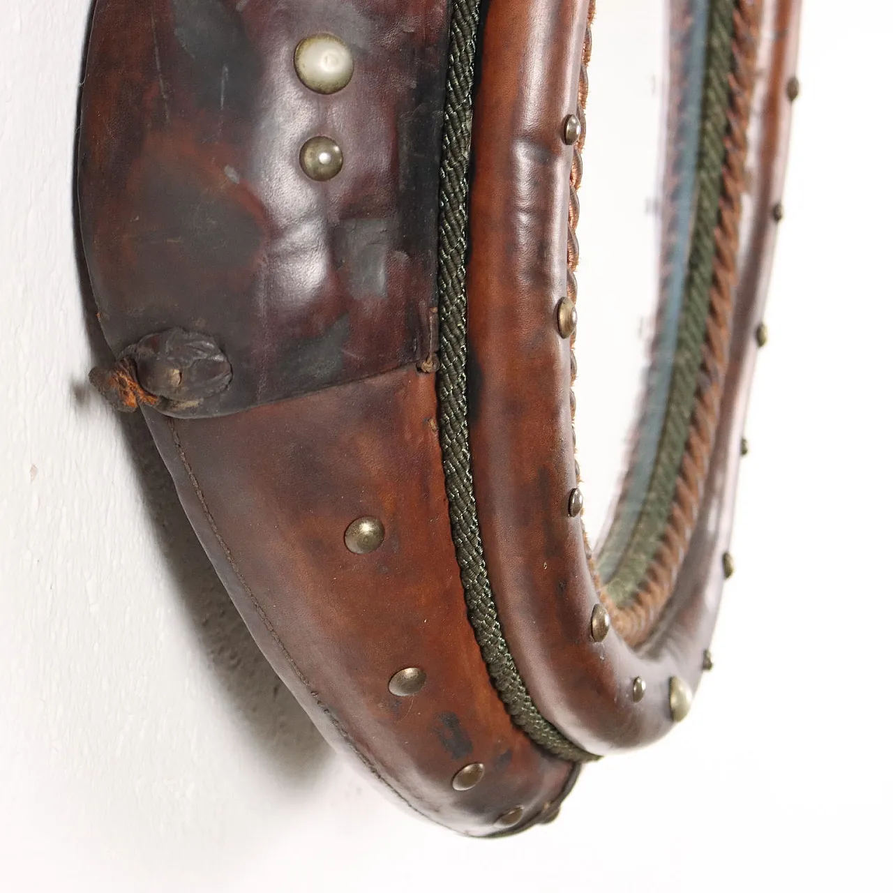 Mirror inside a leather riding saddle with studs 7