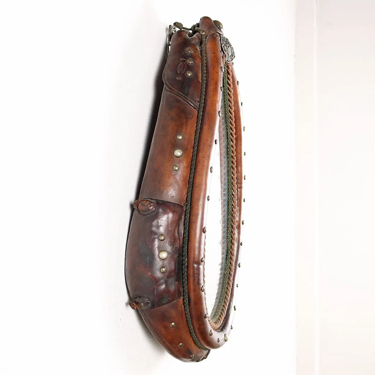 Mirror inside a leather riding saddle with studs 8